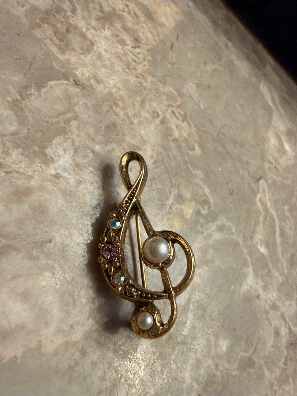 Vintage brand 1928 gold tone, music note brooch with rhinestones and faux pearls